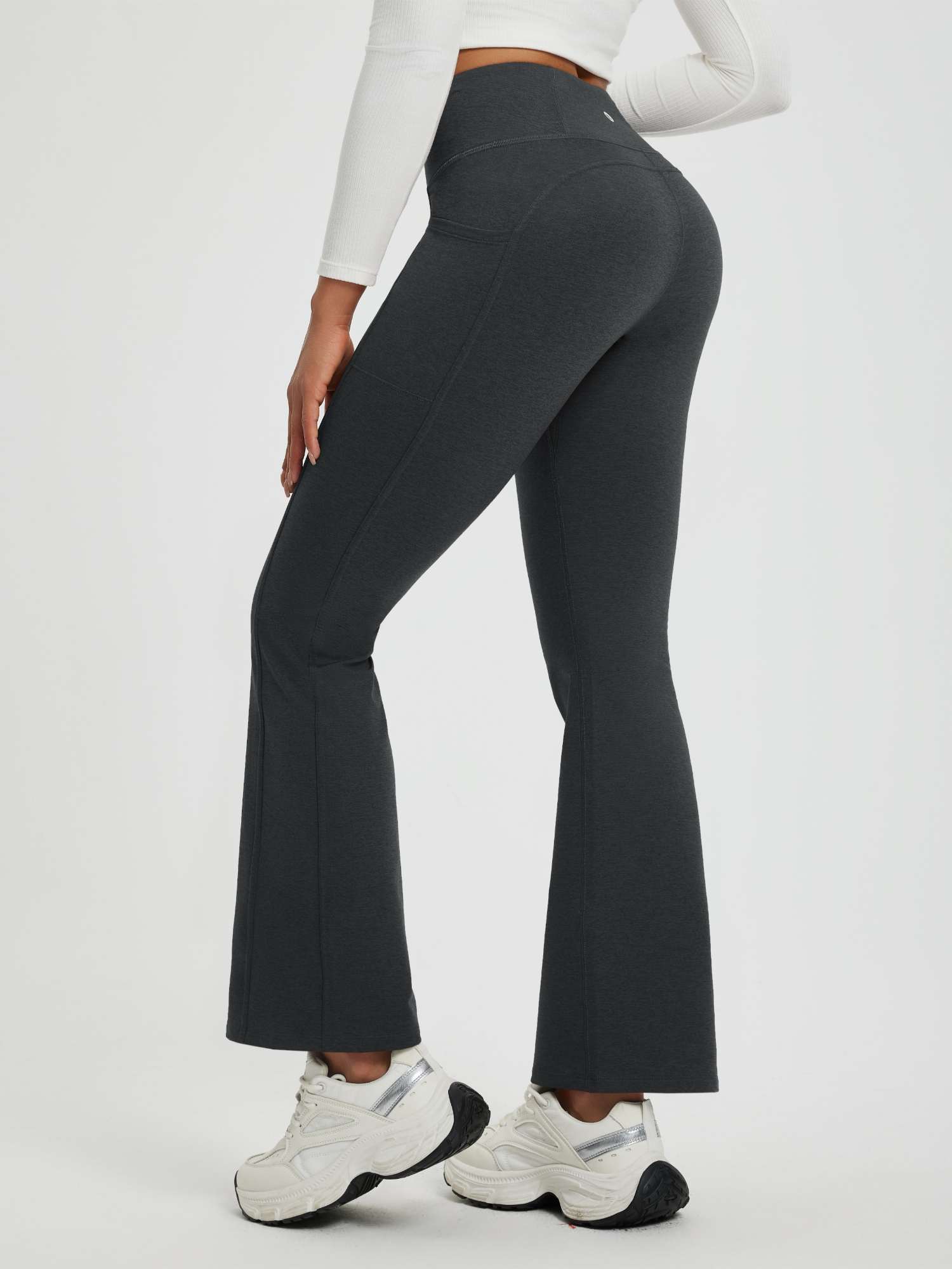 Women's charcoal floral fleece yoga pants with flared legs and pockets. #color_Black