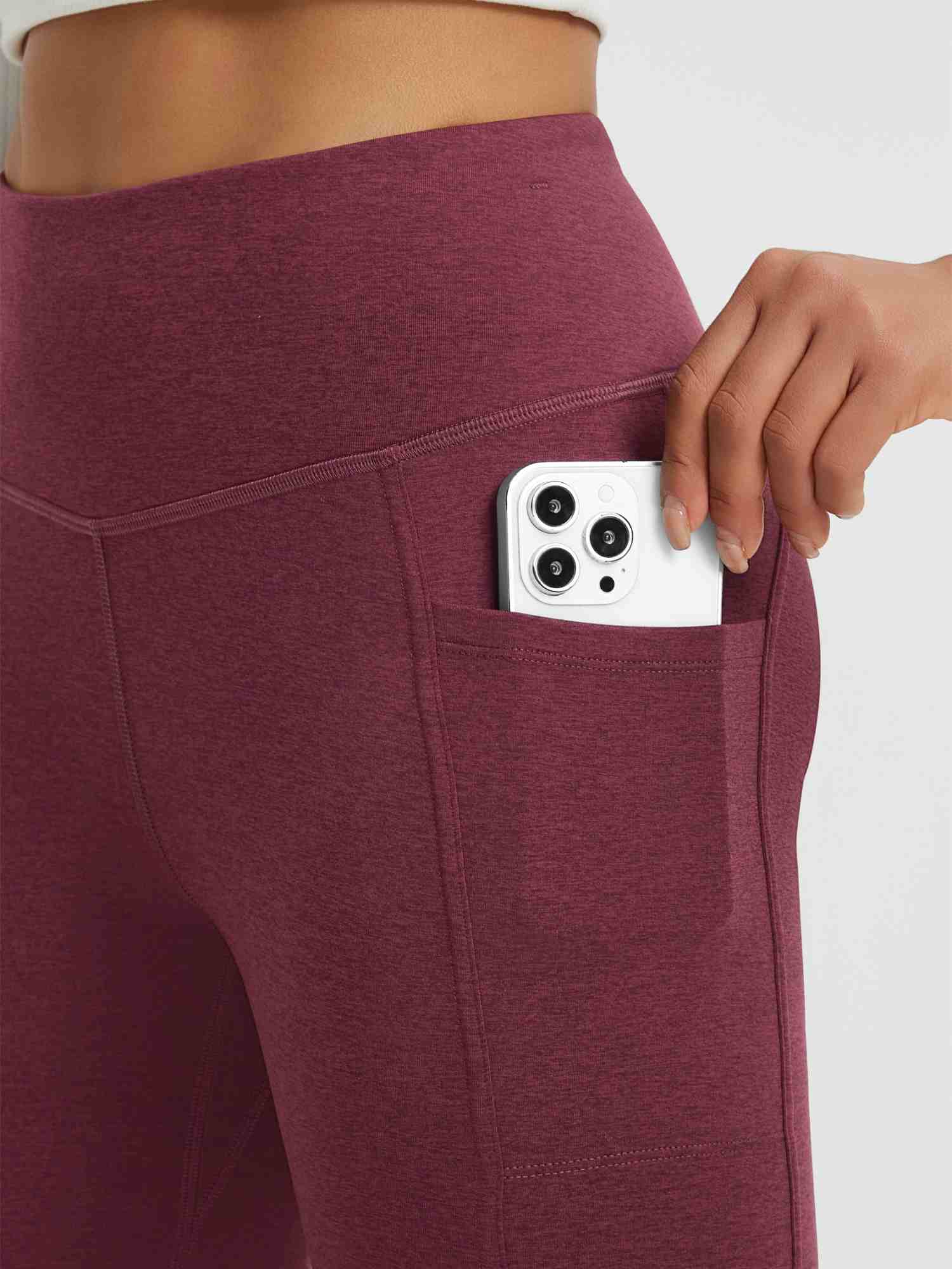 Burgundy women's yoga pants with phone pocket and high-waisted flare design. #color_Wine Red