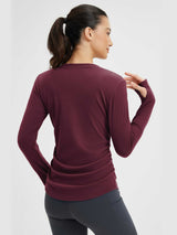 Burgundy side-ruched long-sleeve yoga top with thumbholes for women, ideal for athletic wear and yoga. #Color_Wine Red