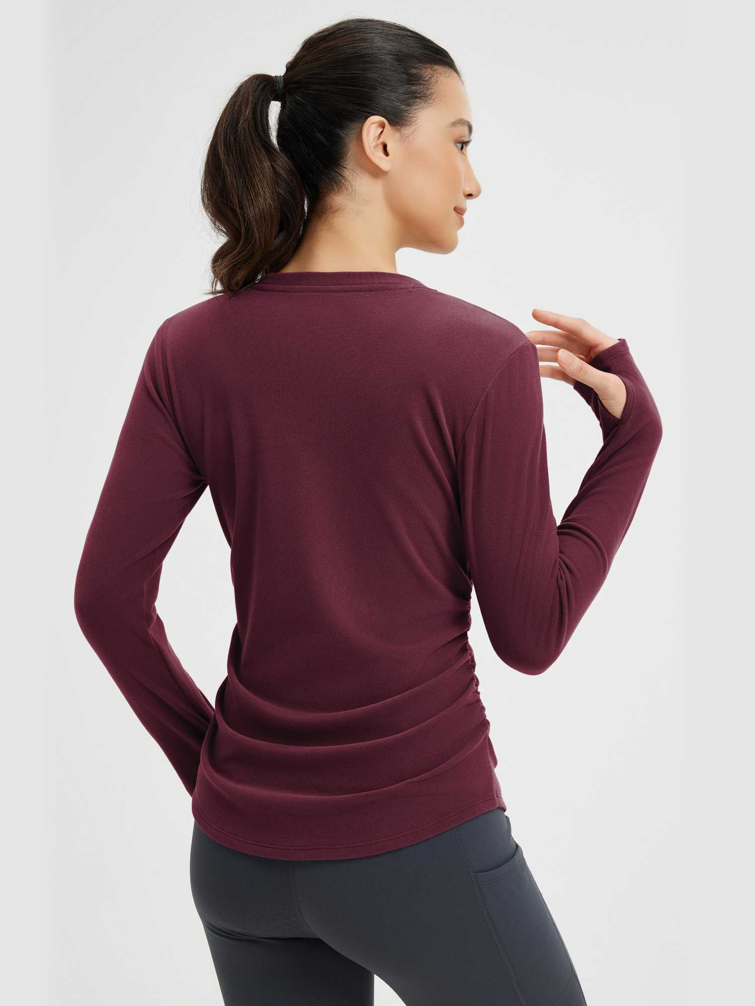 Burgundy side-ruched long-sleeve yoga top with thumbholes for women, ideal for athletic wear and yoga. #Color_Wine Red
