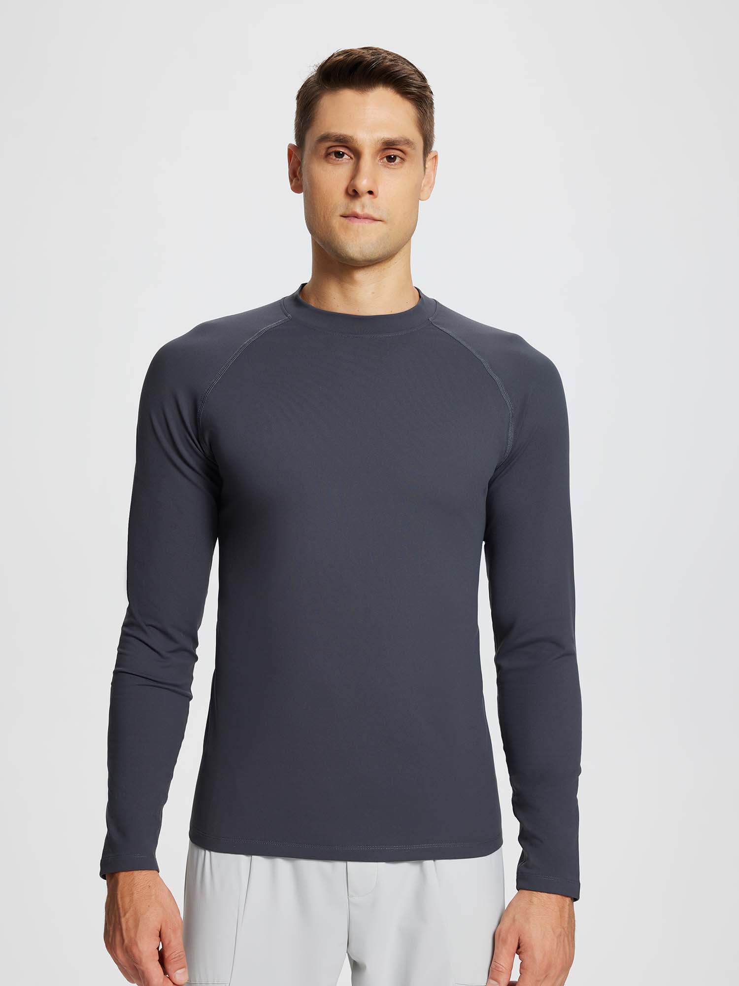 Men's dark gray half-mock knit fleece running top with raglan sleeves and flat seams. #color_Dark Gray