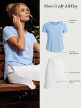 Blue UPF 50+ tee with high-low hem & white skort with pockets. Soft stretch, moisture-wicking.