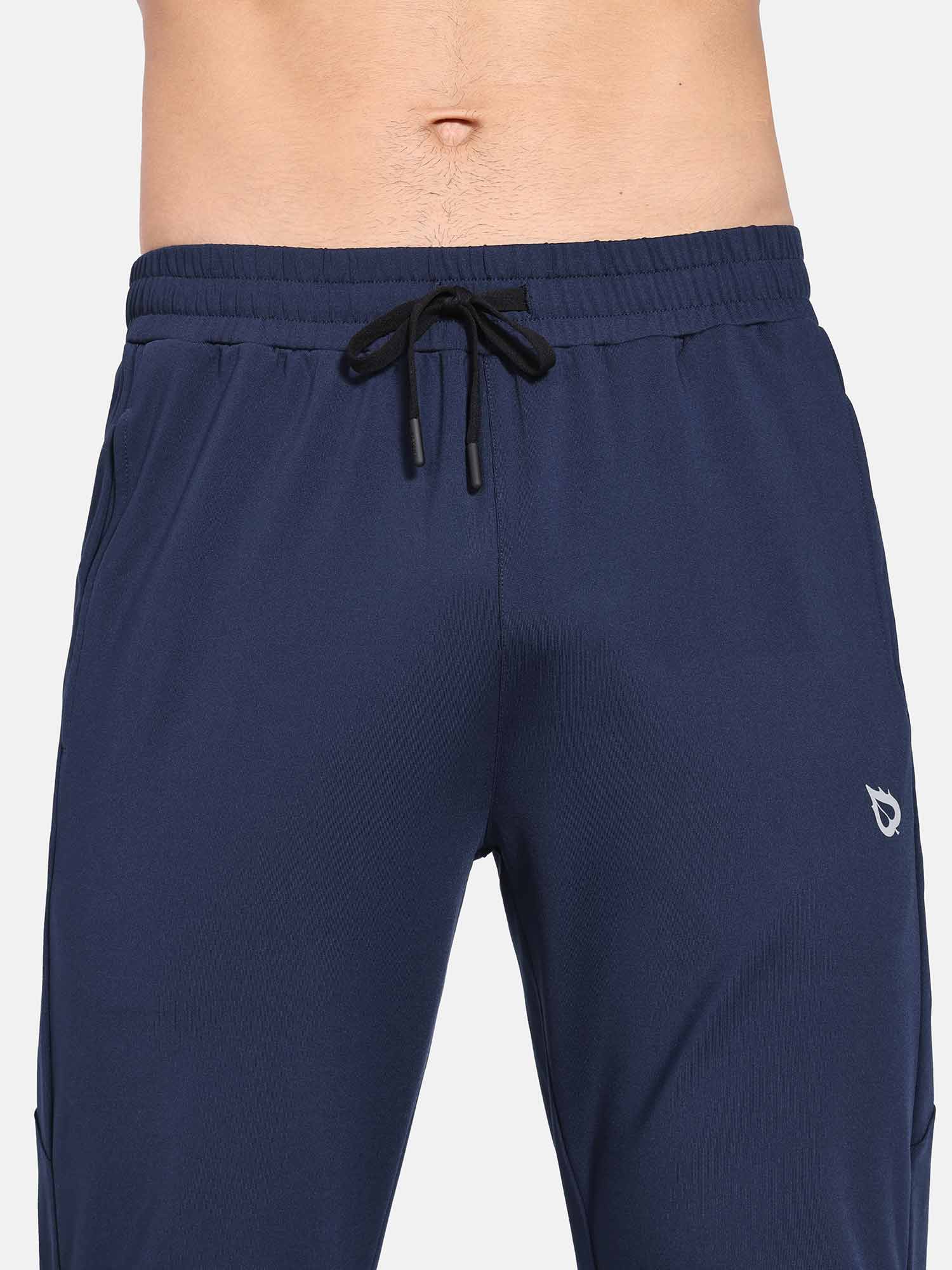 Navy blue men's fleece-lined water-resistant straight leg pants with drawstring waist and subtle logo #color_Navy Blue