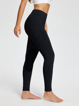 Black horse riding knit skinny breeches leggings with suede knee patches and zip pocket. #color_Black