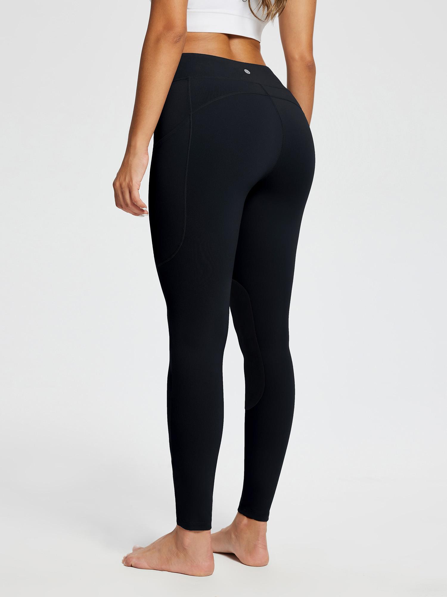 Black knit skinny breeches leggings with suede knee patches and pockets for horse riding. #color_Black