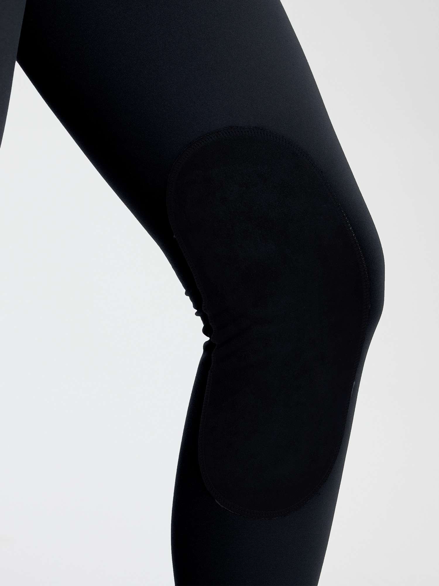 Black horse riding knit skinny breeches leggings with suede knee patches for enhanced grip. #color_Black