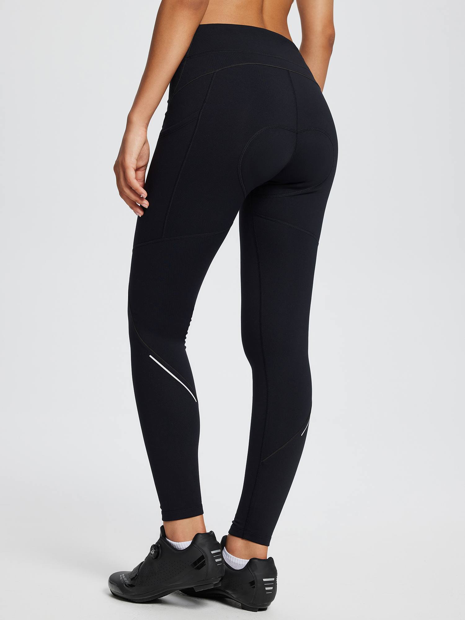 Black women's fleece-padded cycling tights with reflective detail and side pockets #color_Black