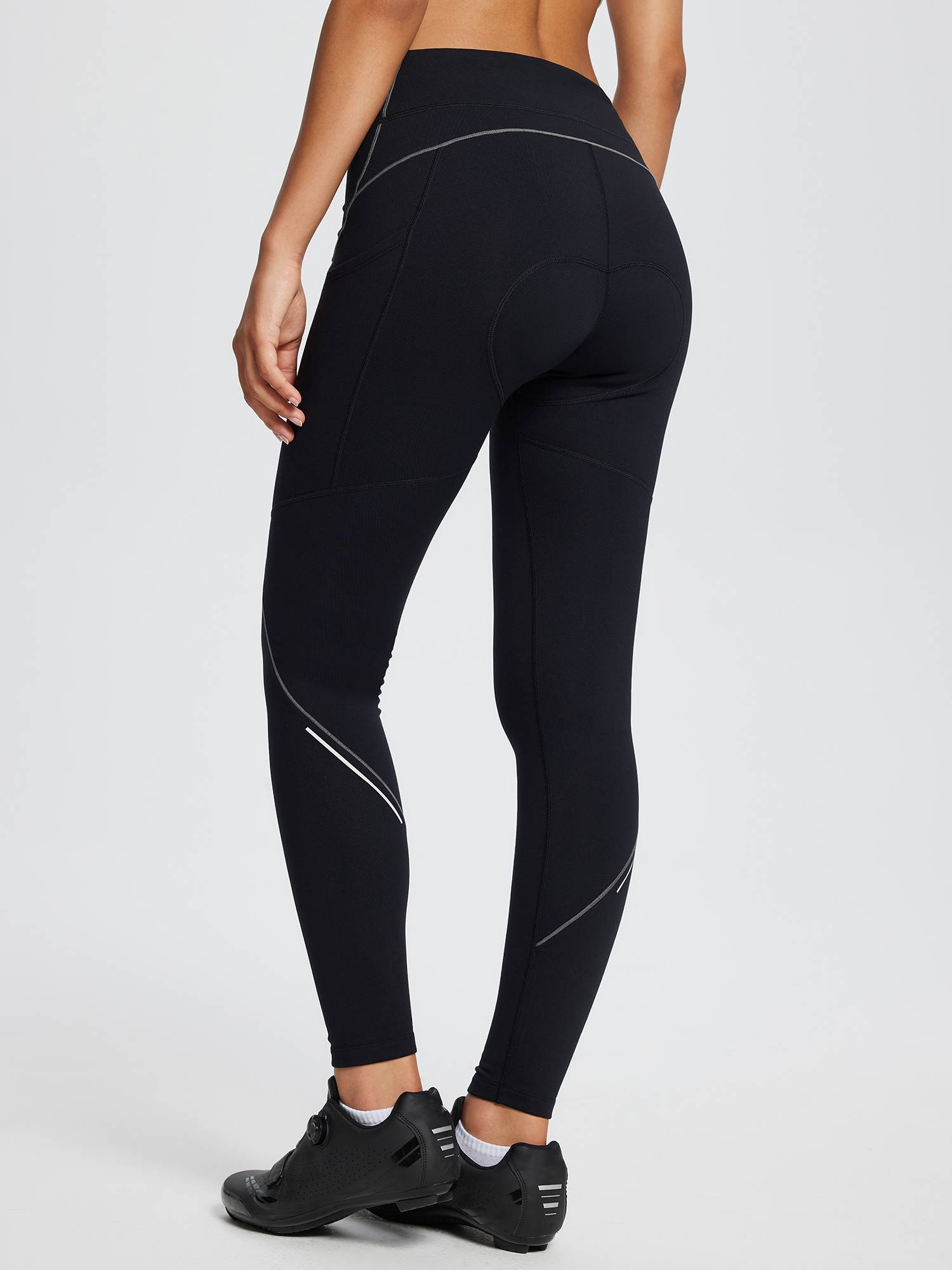 Black fleece-padded cycling tights for women with reflective accents and padded crotch, ideal for winter cycling. #color_Gray