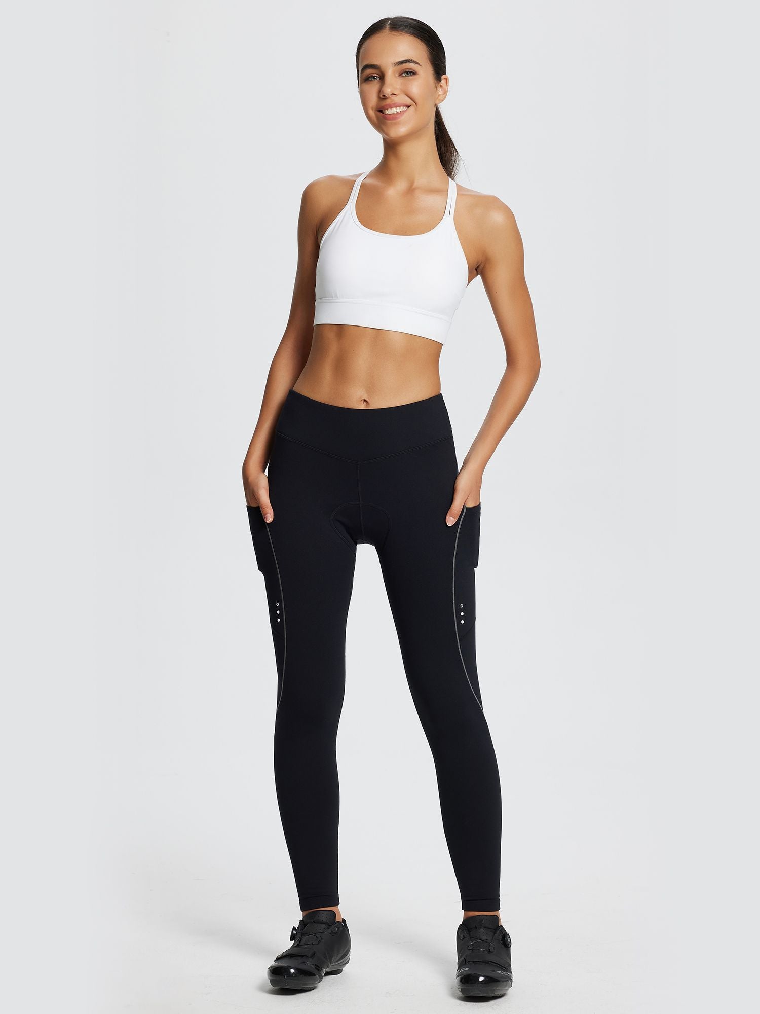 Black women's fleece-padded cycling tights with reflective details and side pockets #color_Gray