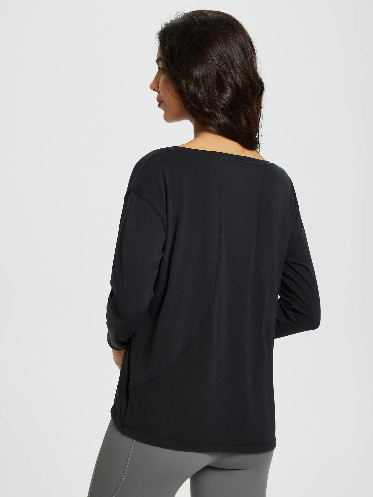 Women's black long-sleeve workout t-shirt with boat neckline and loose fit. #color_Black