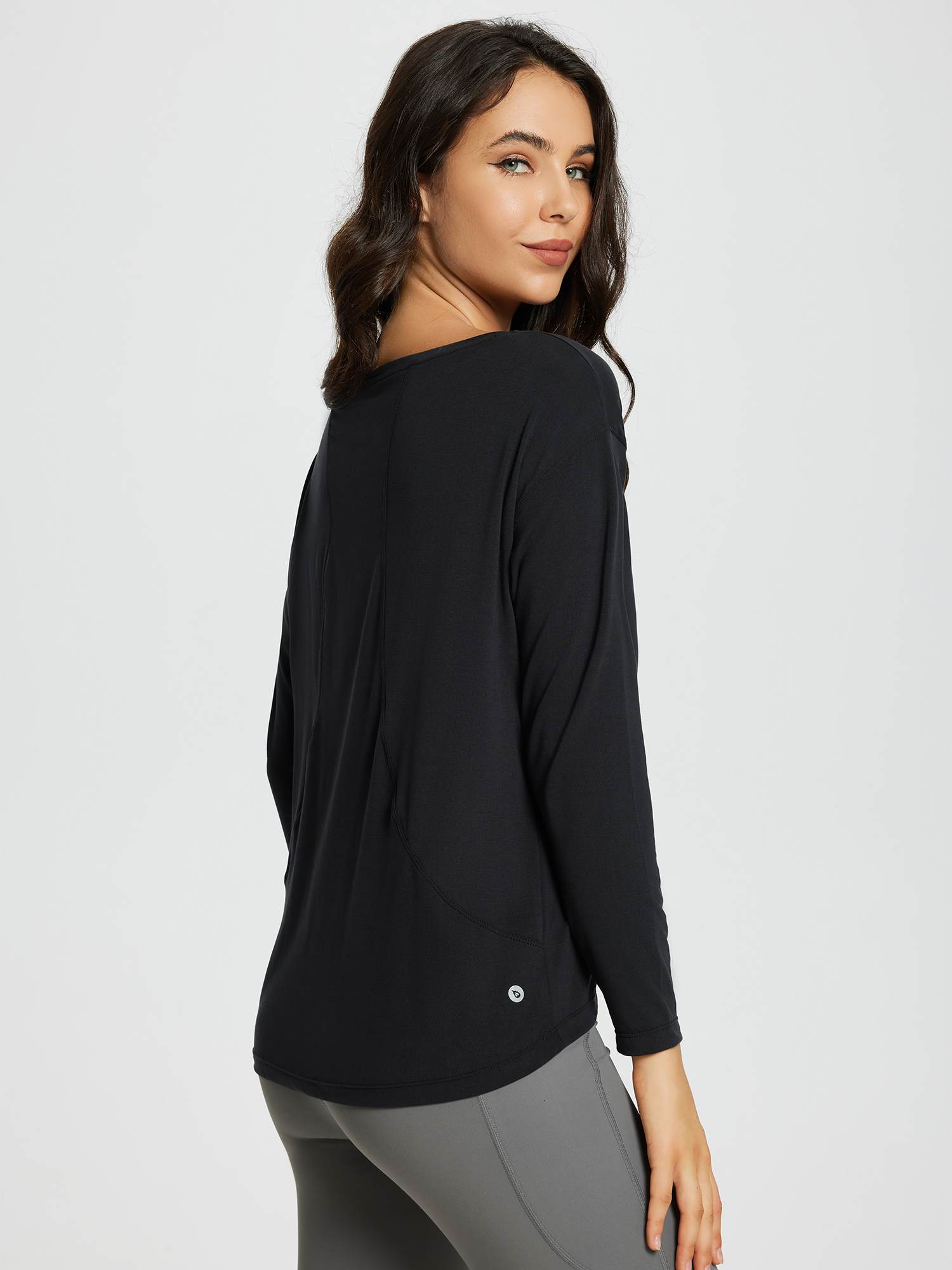 Women's black long-sleeve workout t-shirt with a boat neckline and loose fit. #color_Black