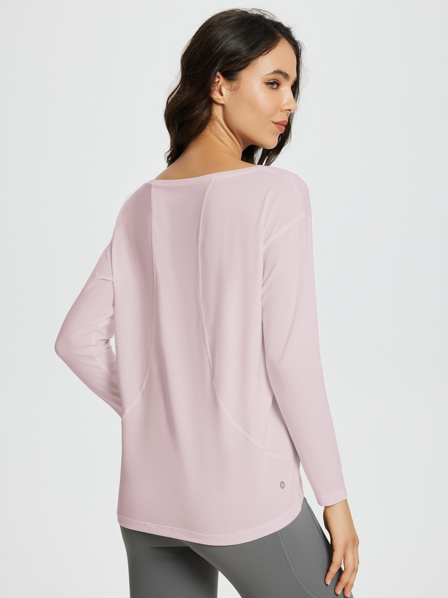 Pink women's long-sleeve workout t-shirt with boat neckline, loose fit, and curved hem detail. #color_Light Purple