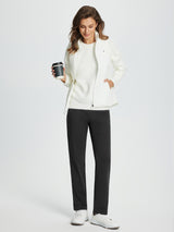 Woman in black fleece-lined golf pants and white sweater, holding a coffee cup. #color_Black