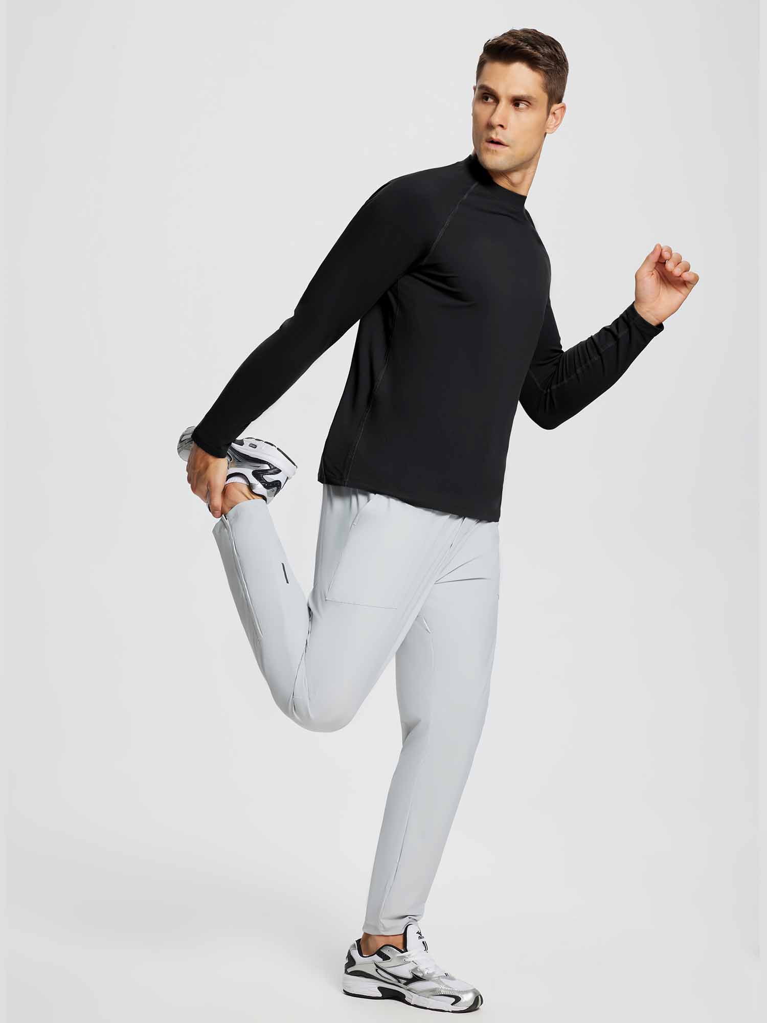 Men's black half-mock knit fleece running top and grey running pants for athletic performance. #color_Black