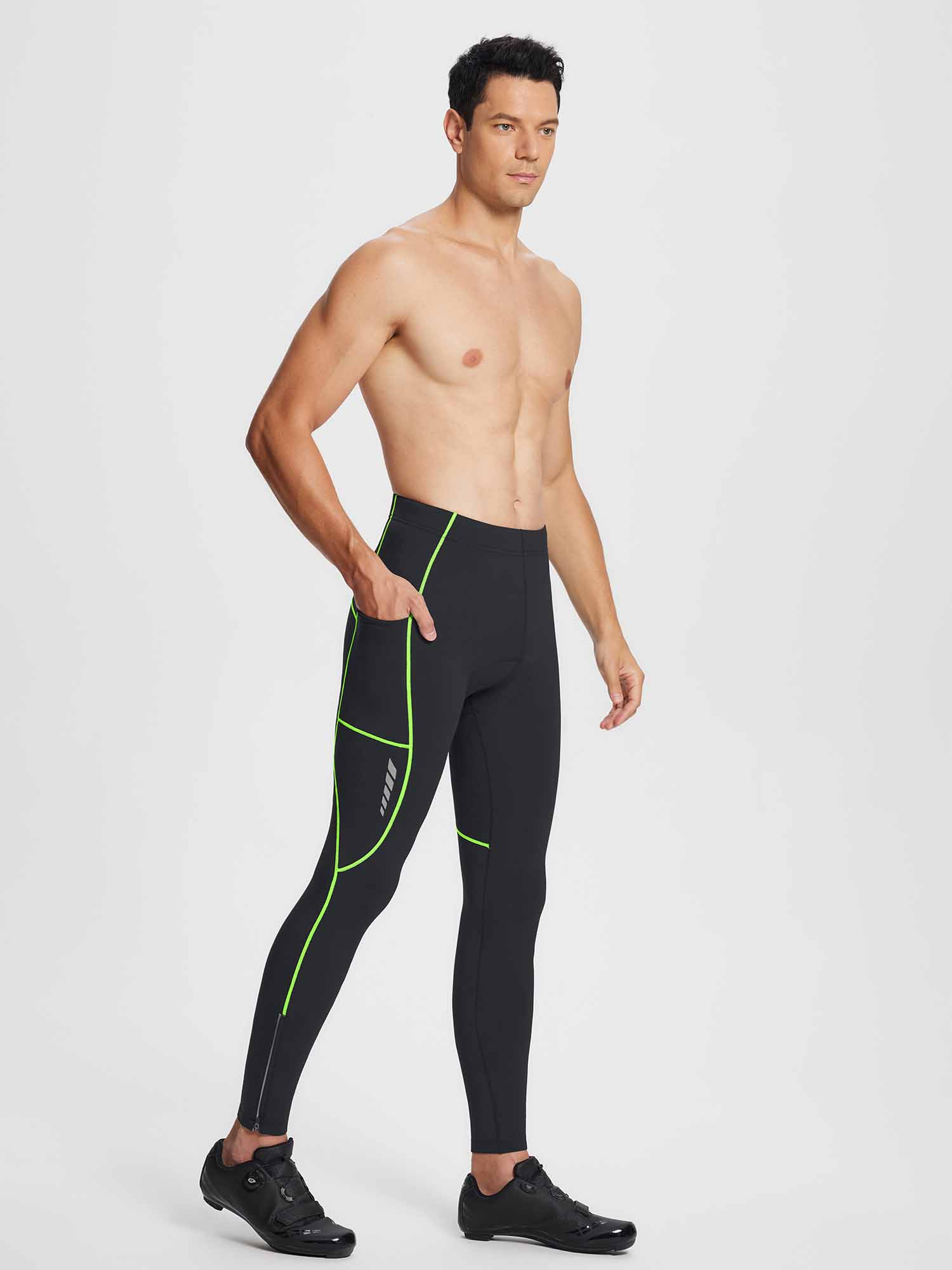 Men's black thermal cycling tights, neon green piping, side pockets, ankle zippers.