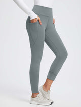 Grey 27" thermal fleece high-waist yoga leggings with pockets, fleece-lined cuffs, and tummy control. #color_Dark Gray