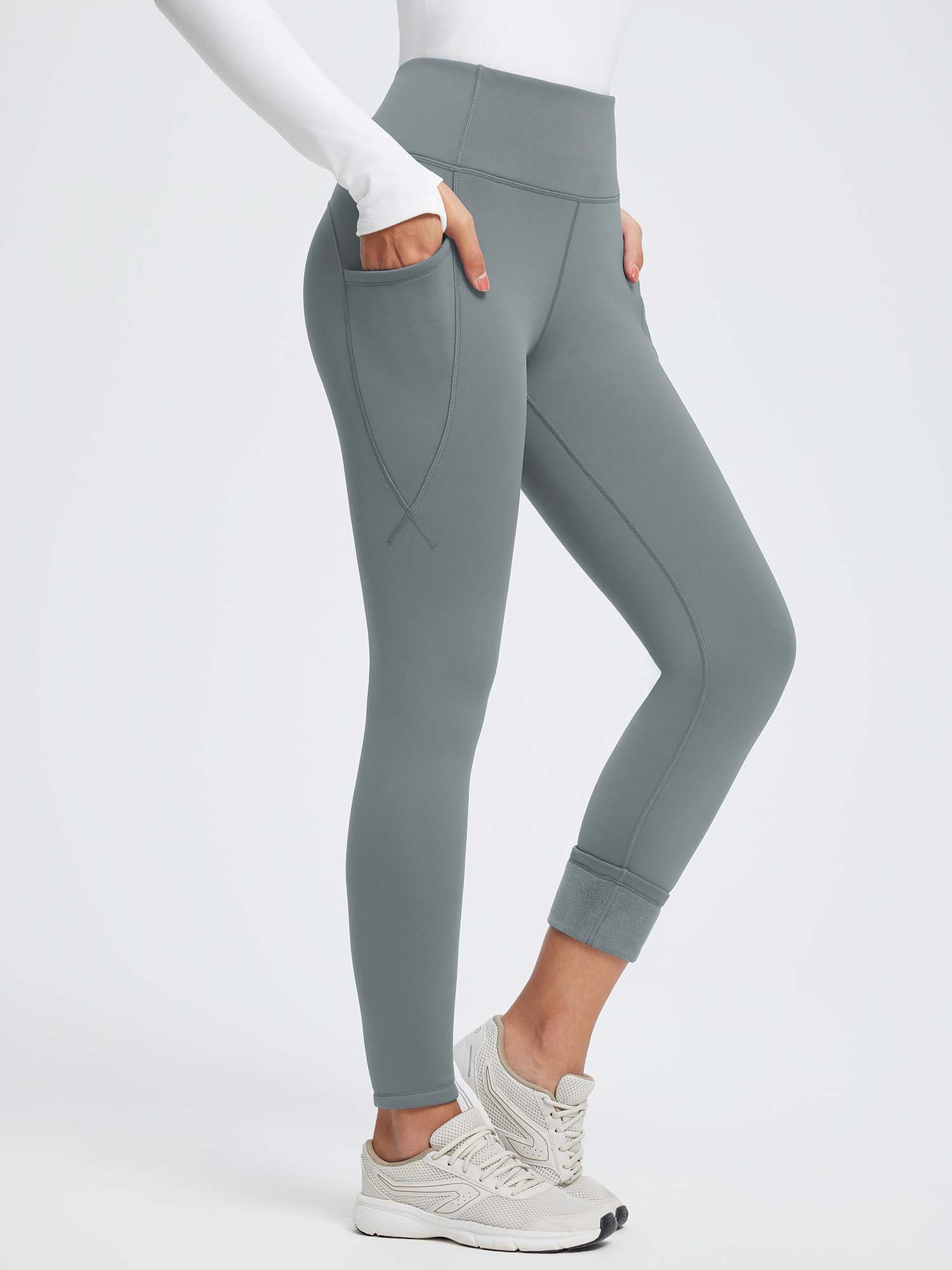 Grey 27" thermal fleece high-waist yoga leggings with pockets, fleece-lined cuffs, and tummy control. #color_Dark Gray