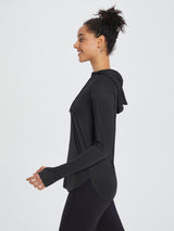 Black UPF 50+ sun hoodie shirt with thumbholes for women, featuring a relaxed fit and curved hem. #color_Black