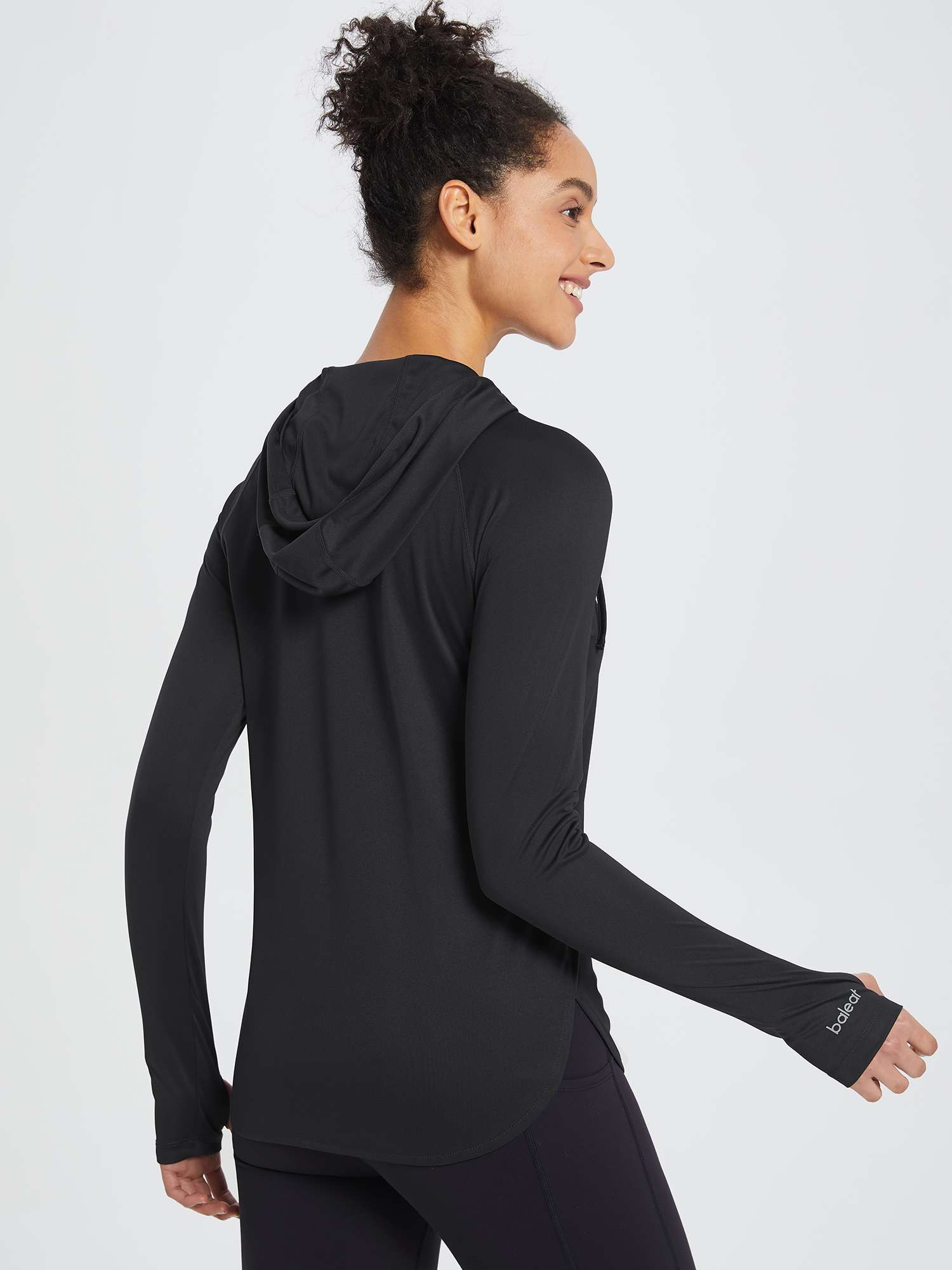 Black UPF 50+ sun hoodie shirt with thumbholes and BALEAF logo on sleeve. #color_Black