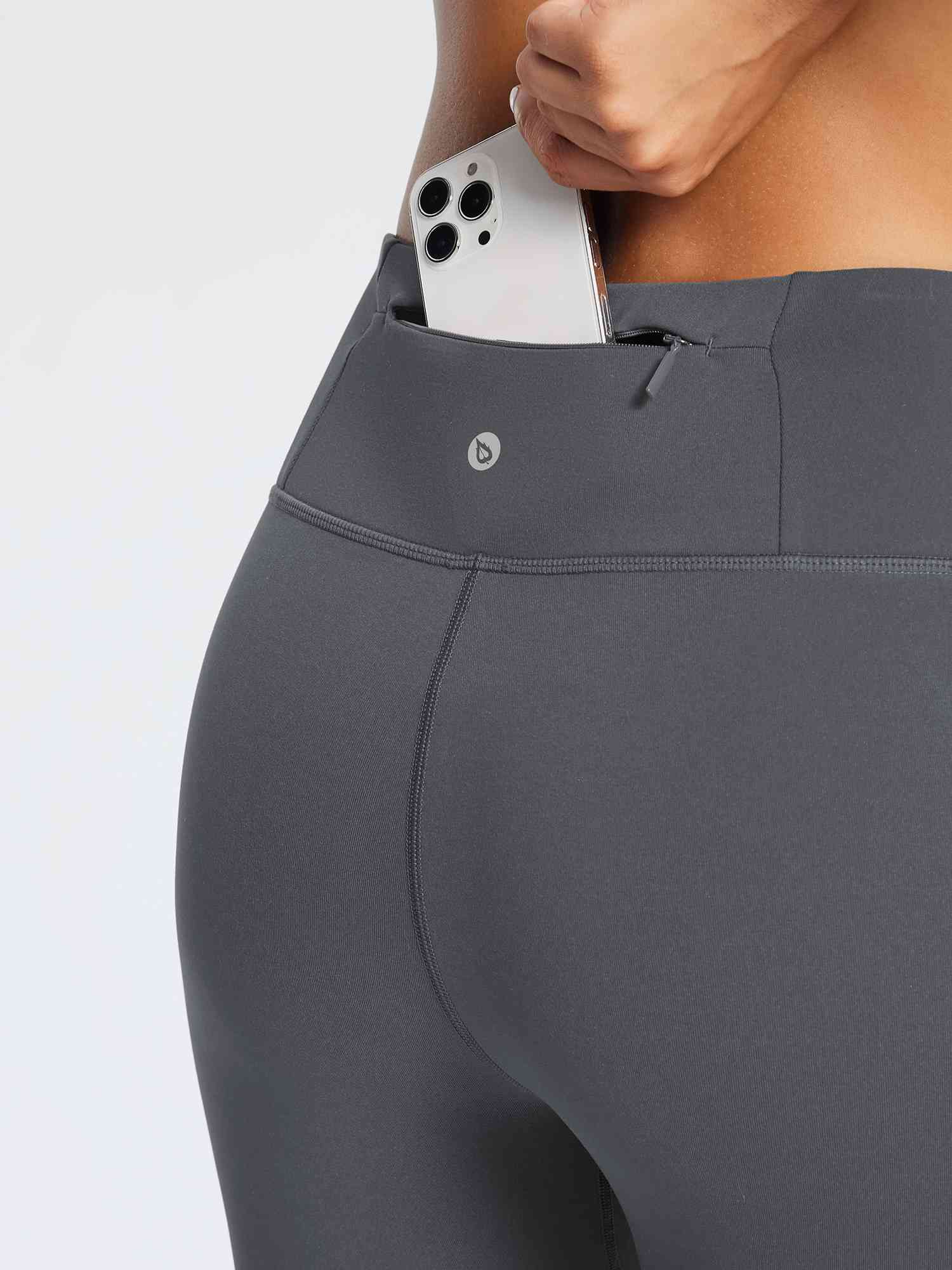 Dark gray running fleece leggings with a phone pocket and zipper detail. #color_Light Gray