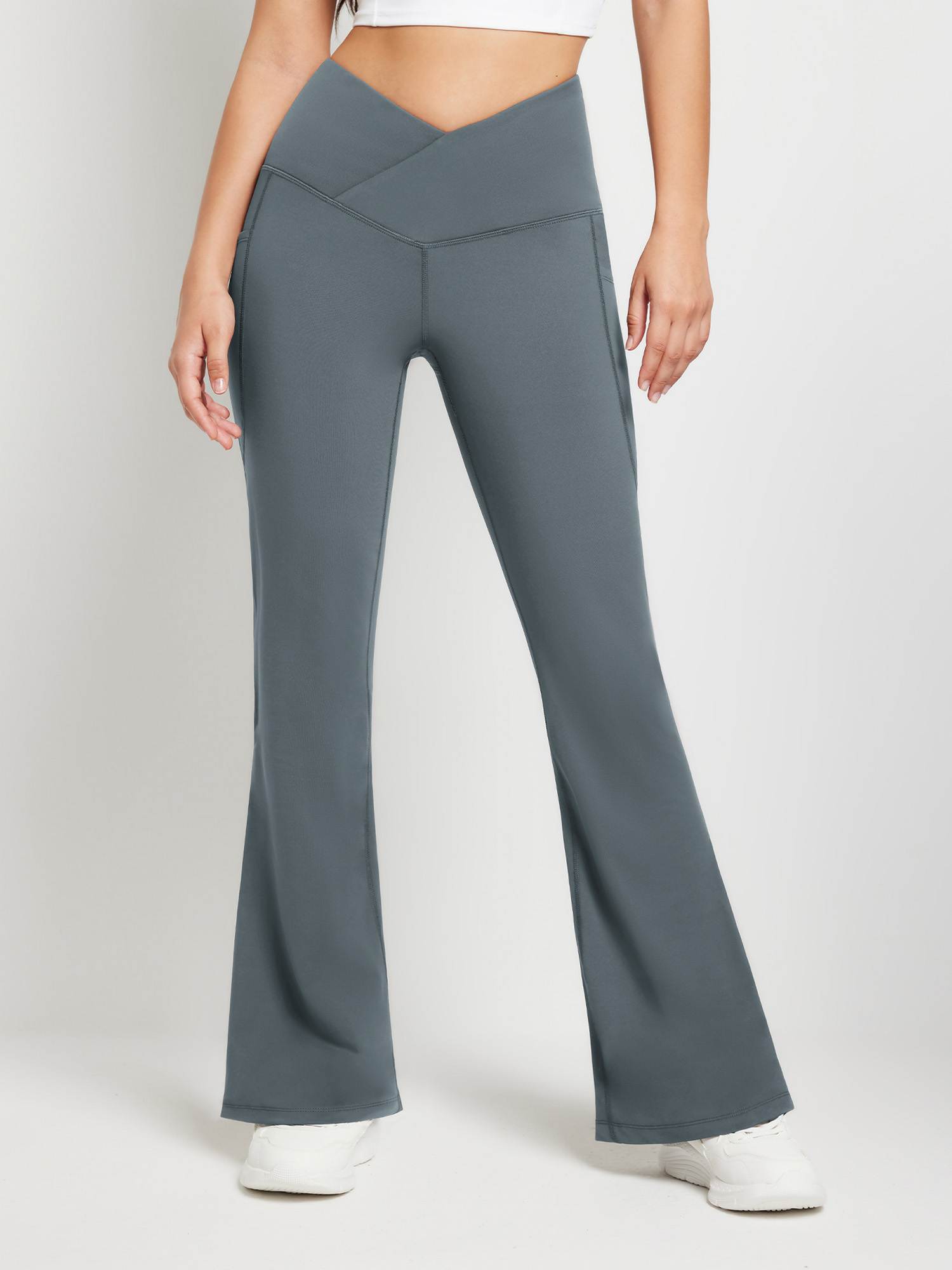 Grey crossover waist fleece flare pants with side pockets and flared leg for women's activewear. #color_Dark Gray