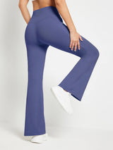 Periwinkle blue fleece crossover waist flare pants with pocket, flared leg, worn with white sneakers.