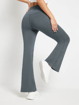 Gray fleece-lined crossover waist flare pants with pockets, showing the flattering fit and wide leg opening. #color_Dark Gray