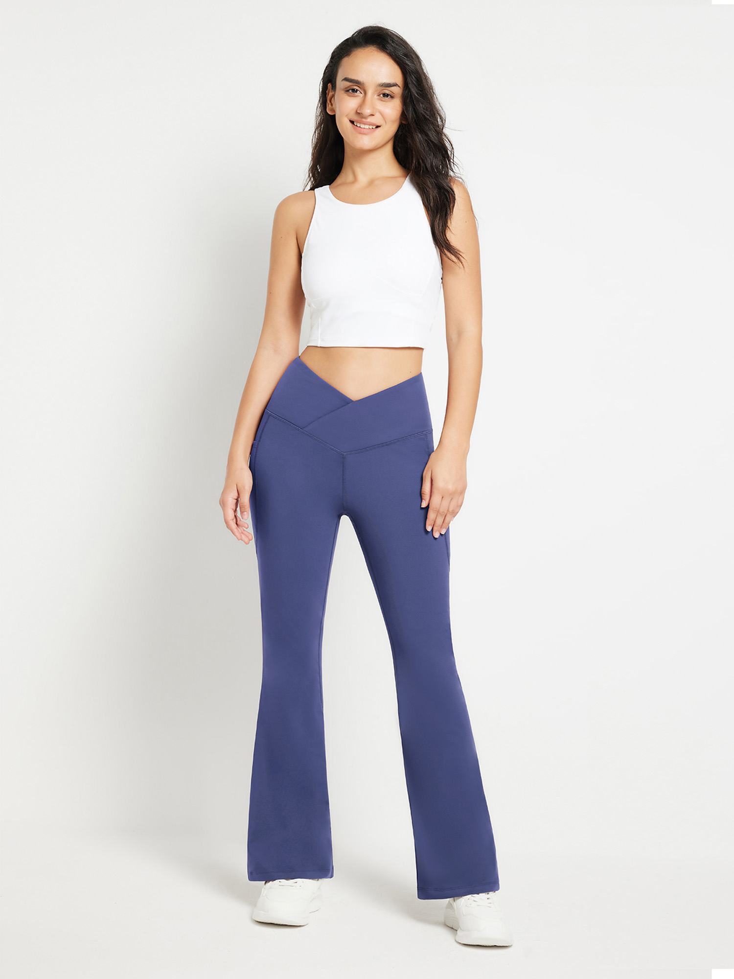 Blue crossover waist fleece flare pants with V-seam and flared leg.