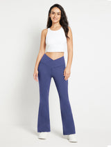 Blue crossover waist fleece flare pants with V-seam and flared leg.
