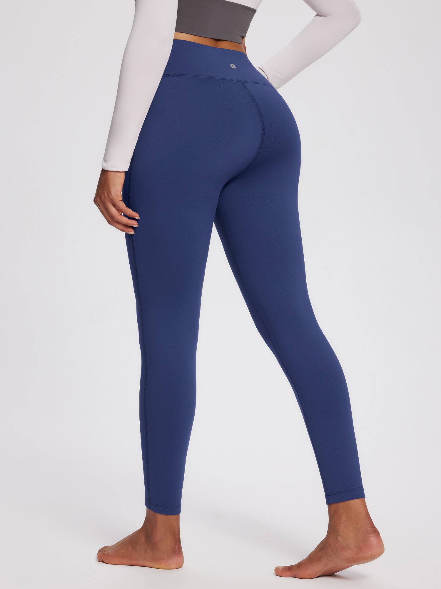 Women's navy blue petite fleece-lined yoga leggings with high waistband.