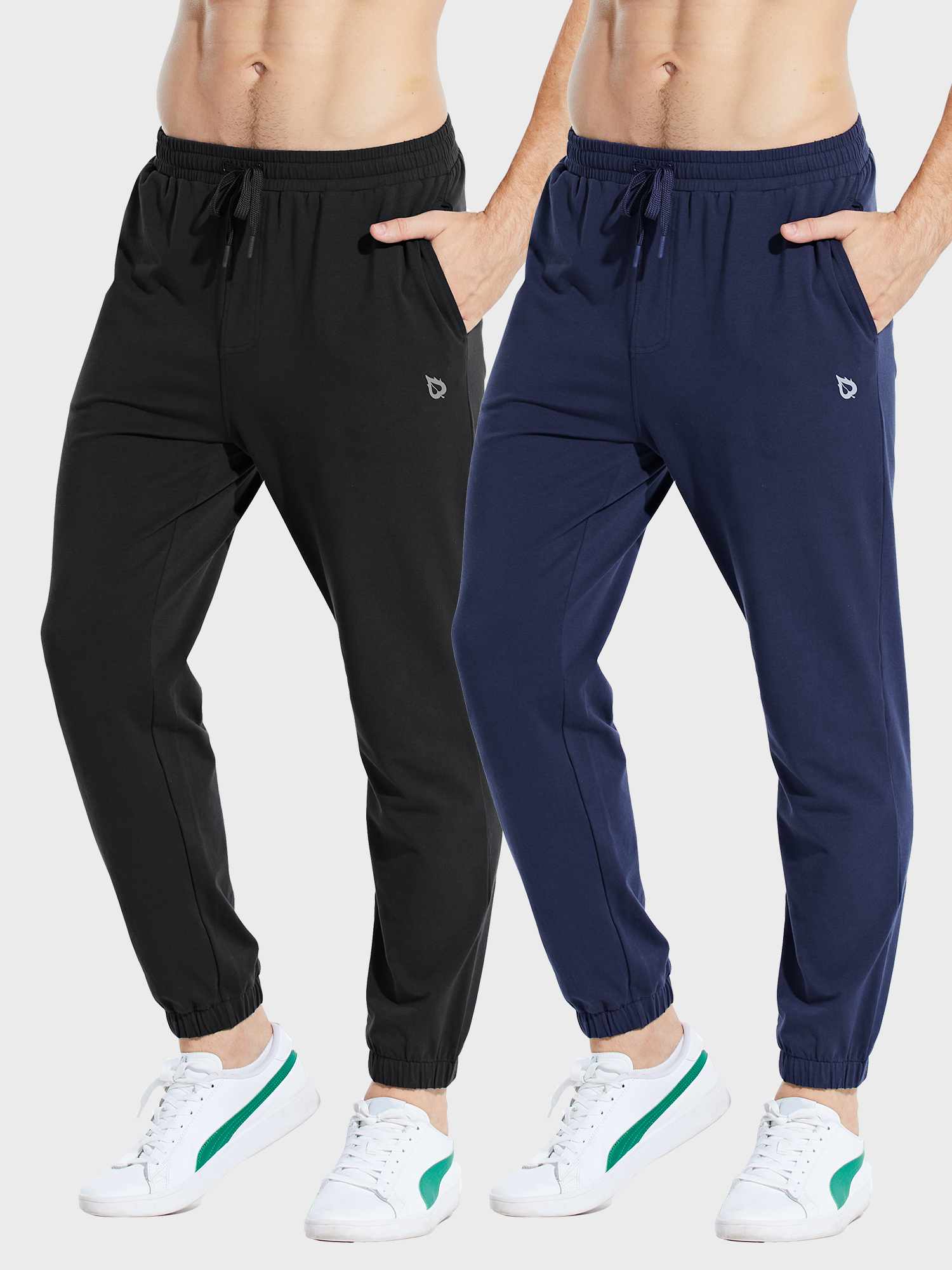 Men's cotton joggers in black and navy blue. Features drawstring waist, pockets, cuffed ankles. Ideal for casual wear. #color_Black/Blue