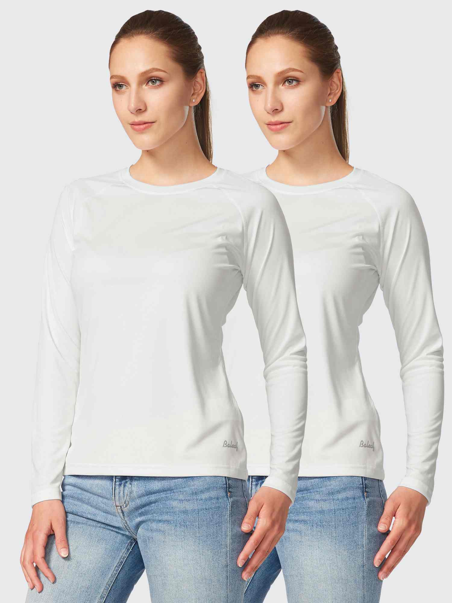 Two women in white long-sleeve UPF 50+ rash guards with quick-dry fabric.