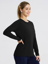 Woman in black long-sleeve rash guard, UPF 50+ sun protection, quick-dry fabric. #color_Black