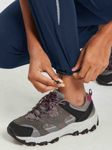 Navy UPF50+ DWR hiking pants adjustable ankle drawstring with reflective pattern.